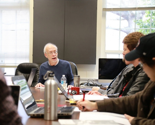 Dr. O'Toole teaches a doctoral capstone class in Baldwin Hall.